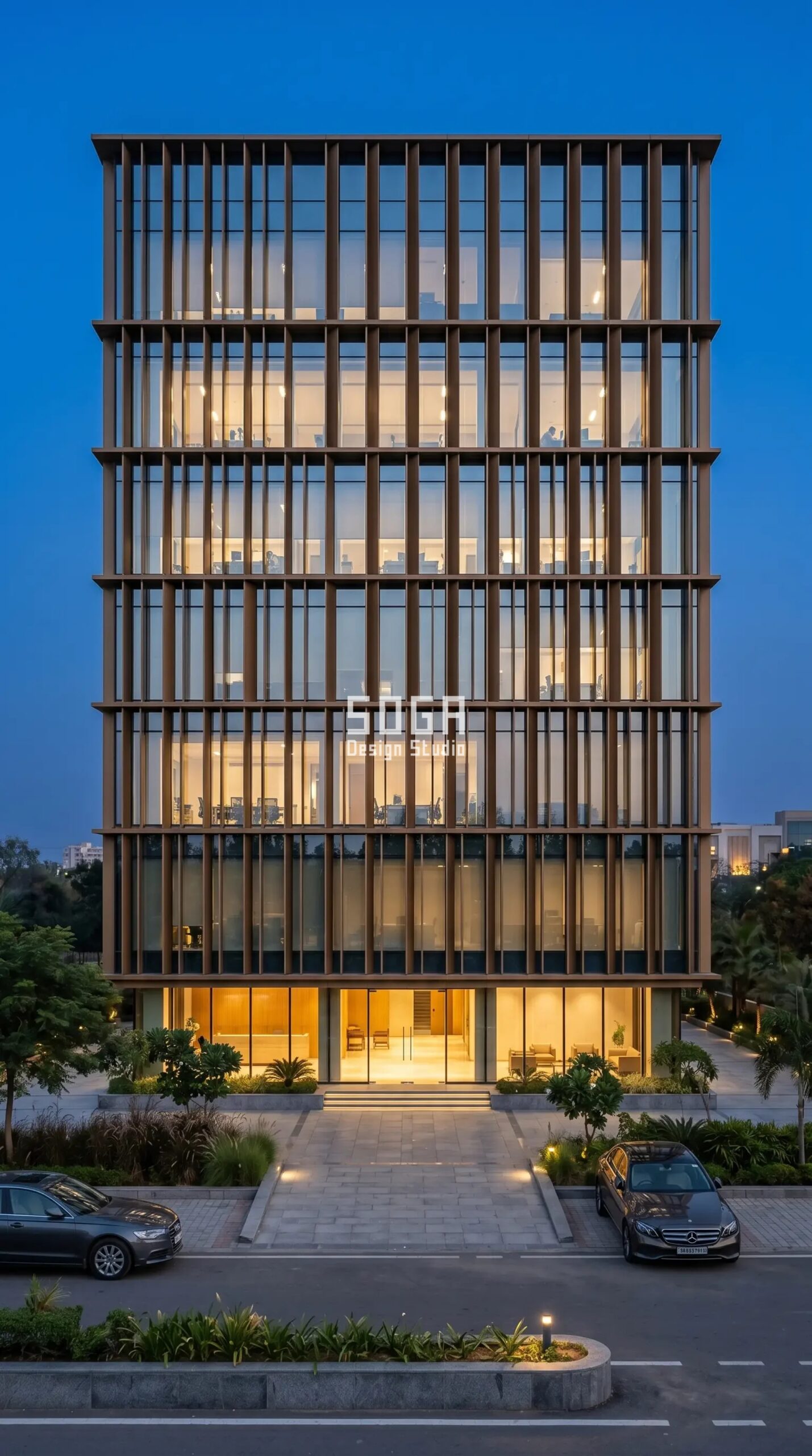 glass commercial facade wrapped in parametric metal shading screen at dusk India