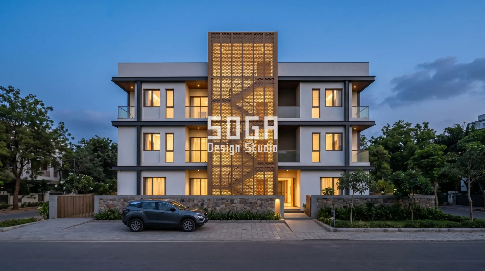backlit jaali screen glowing at night on modern house exterior wall India