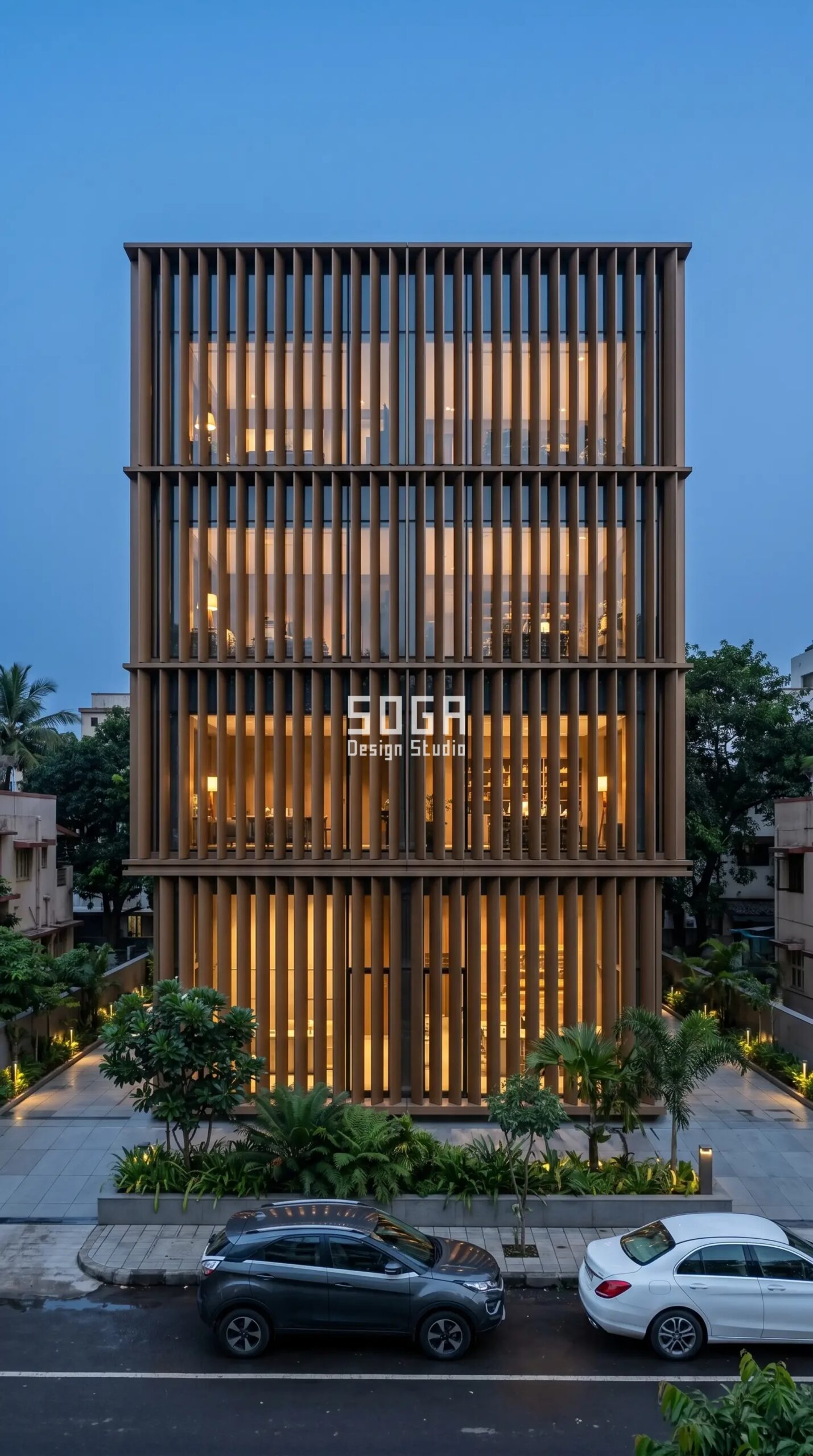 building facade with SOGA vertical metal fin facade at dusk India