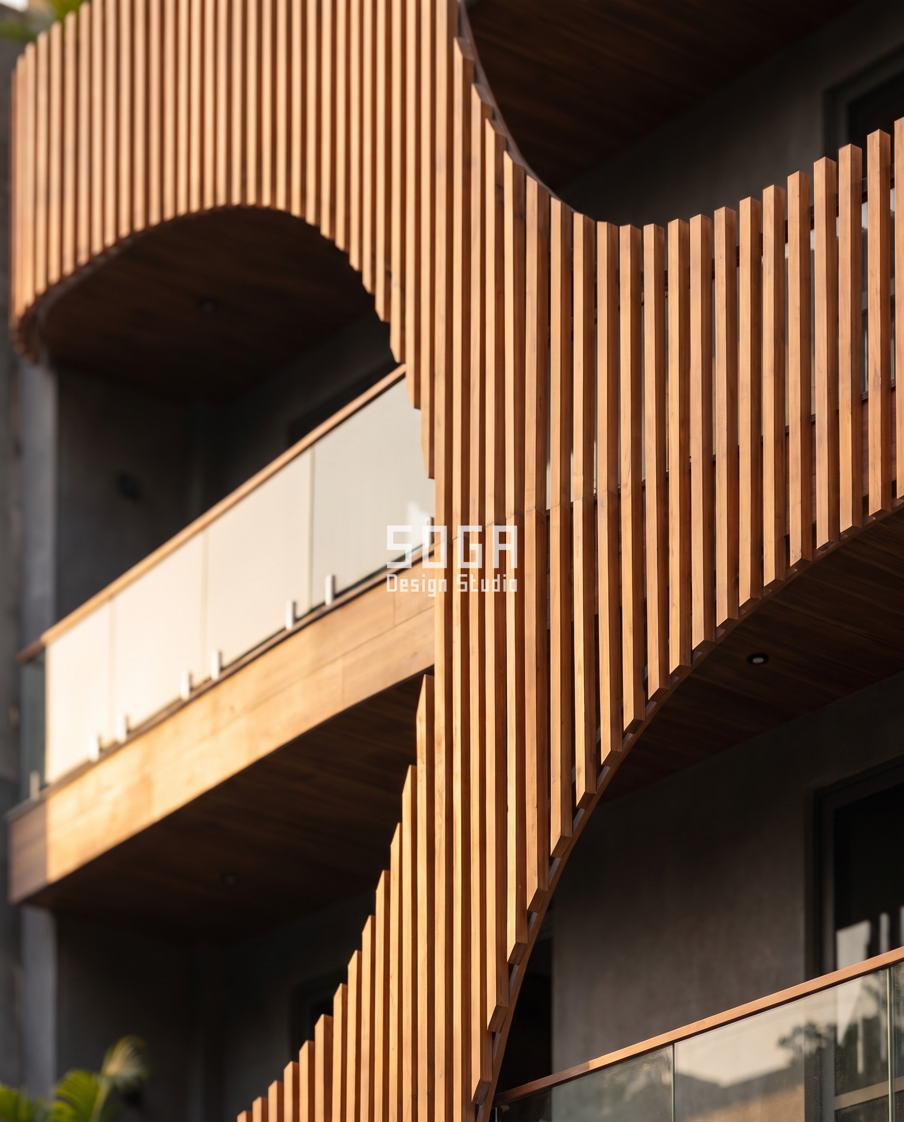 Wood finish aluminium louver fins golden hour detail Indian facade - SOGA Design Studio