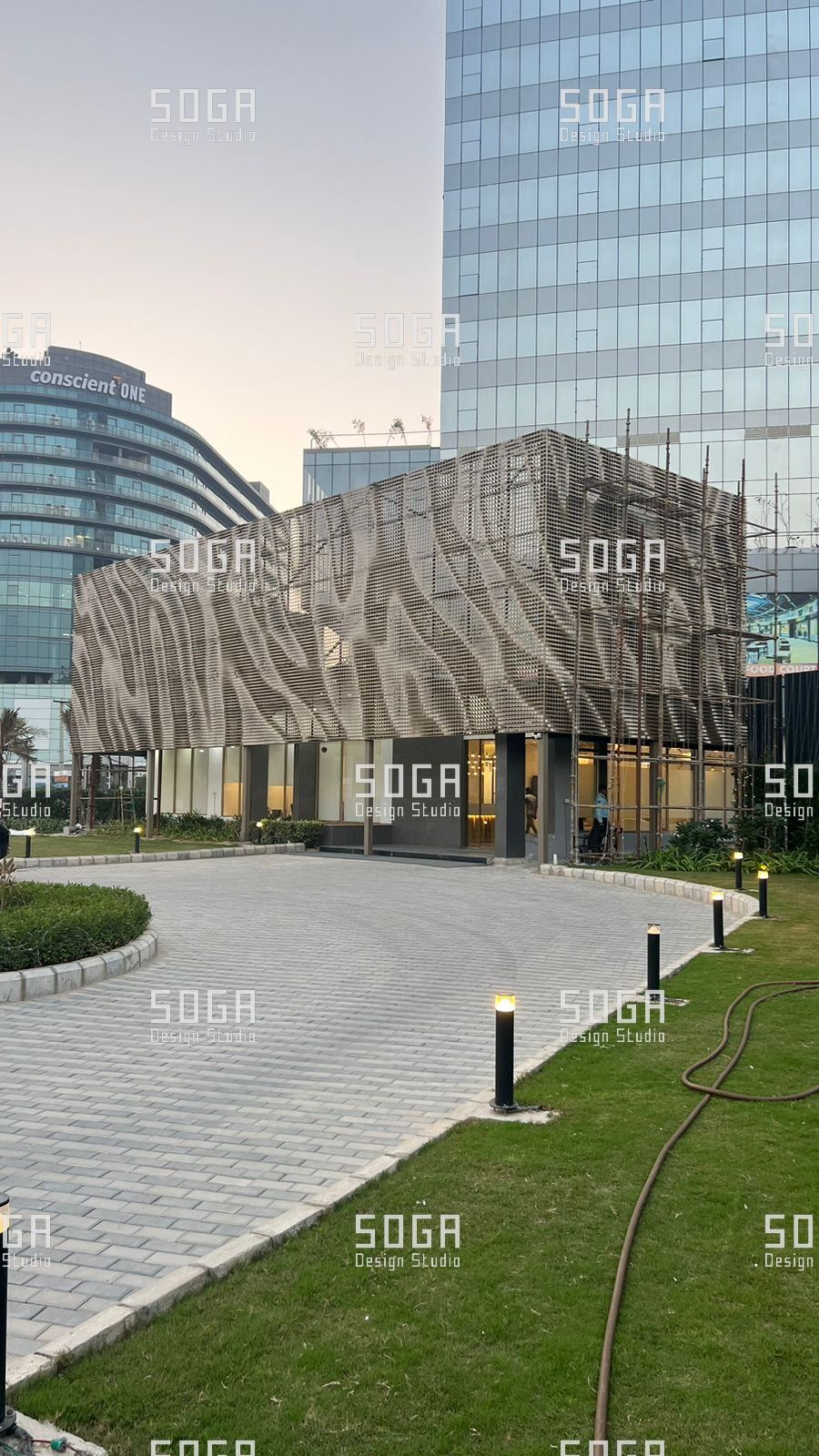 SOGA Coin Facade Installation: Sequencing, Tolerance and Site Realities in India 3 Completed coin facade installation across a commercial building elevation in India