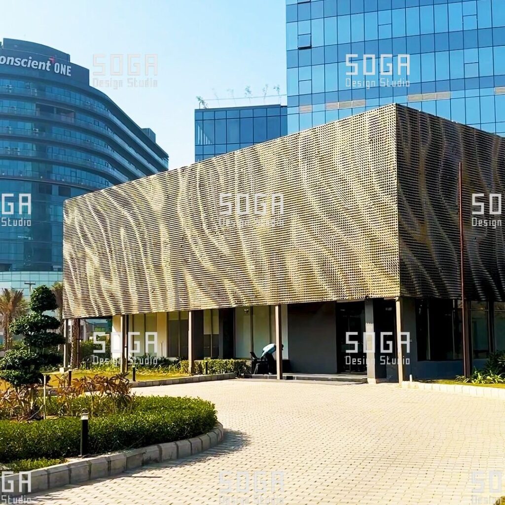 SOGA Coin Facade: The Complete Guide to Circular Parametric Metal Panels 9 Coin facade of circular metal discs forming a wave pattern across a commercial building elevation in India