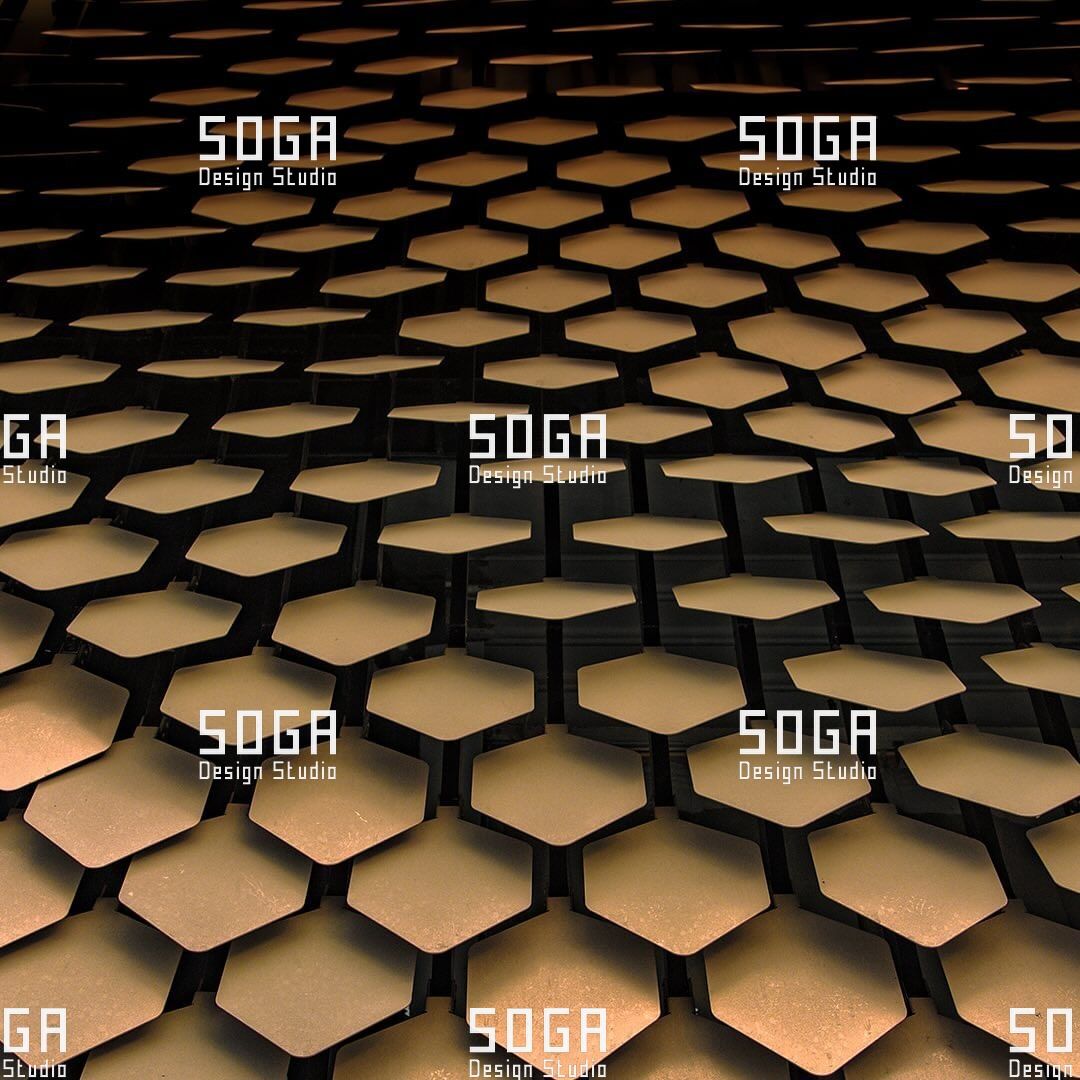 Sequin facade scales seen against a dark background, showing standoff depth and the ventilated cavity behind