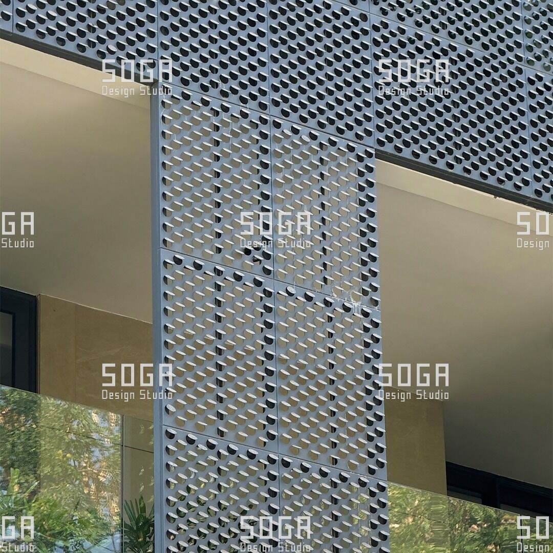 SOGA Coin Facade: The Complete Guide to Circular Parametric Metal Panels 7 Coin facade disc edge and surface finish seen close up beside a window reveal