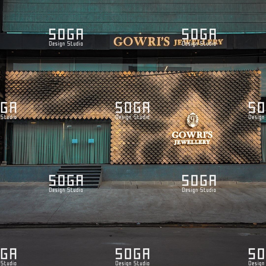 Installed sequin facade elevation on a retail frontage showing continuous scale coverage across the wall