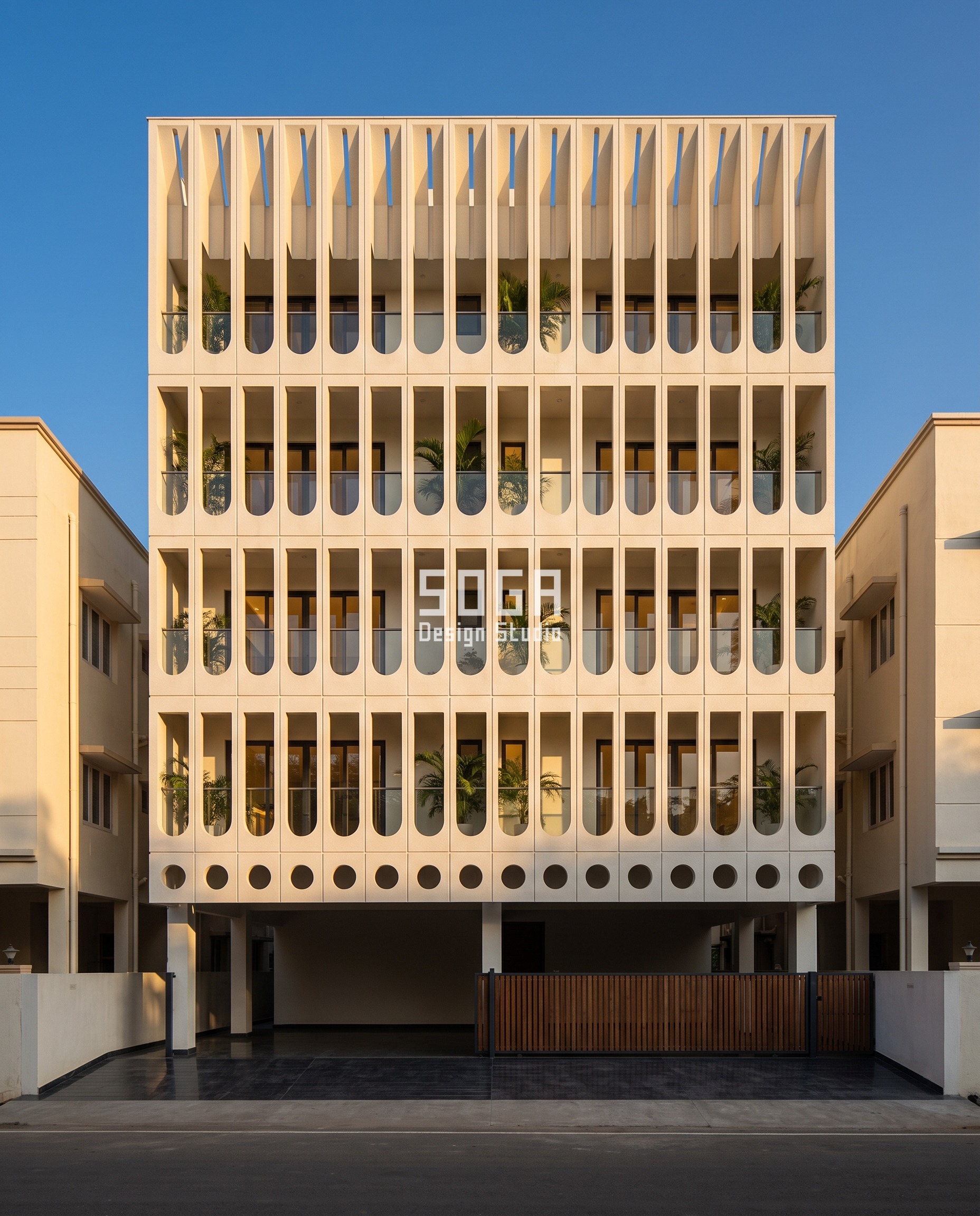 Attractor Point Facade Design: How Parametric Skins Work 3 Precast concrete facade in Coimbatore where openings morph from 300 mm circles at the base into 1,400 mm tall slots at the parapet on a fixed grid