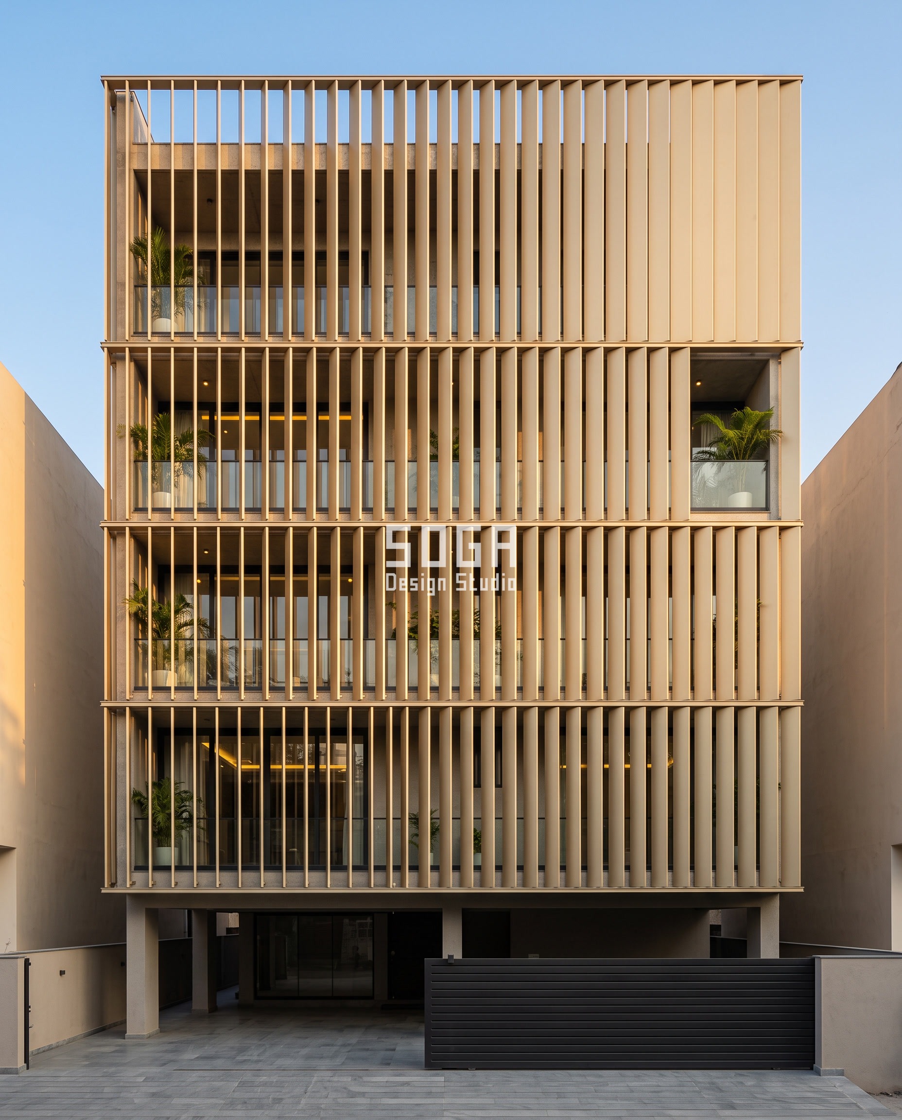 Attractor Point Facade Design: How Parametric Skins Work 1 Attractor point facade design in Jaipur: forty upright champagne-toned metal blades on identical centres, each rotated to its own angle so the screen opens from edge-on to flat-on