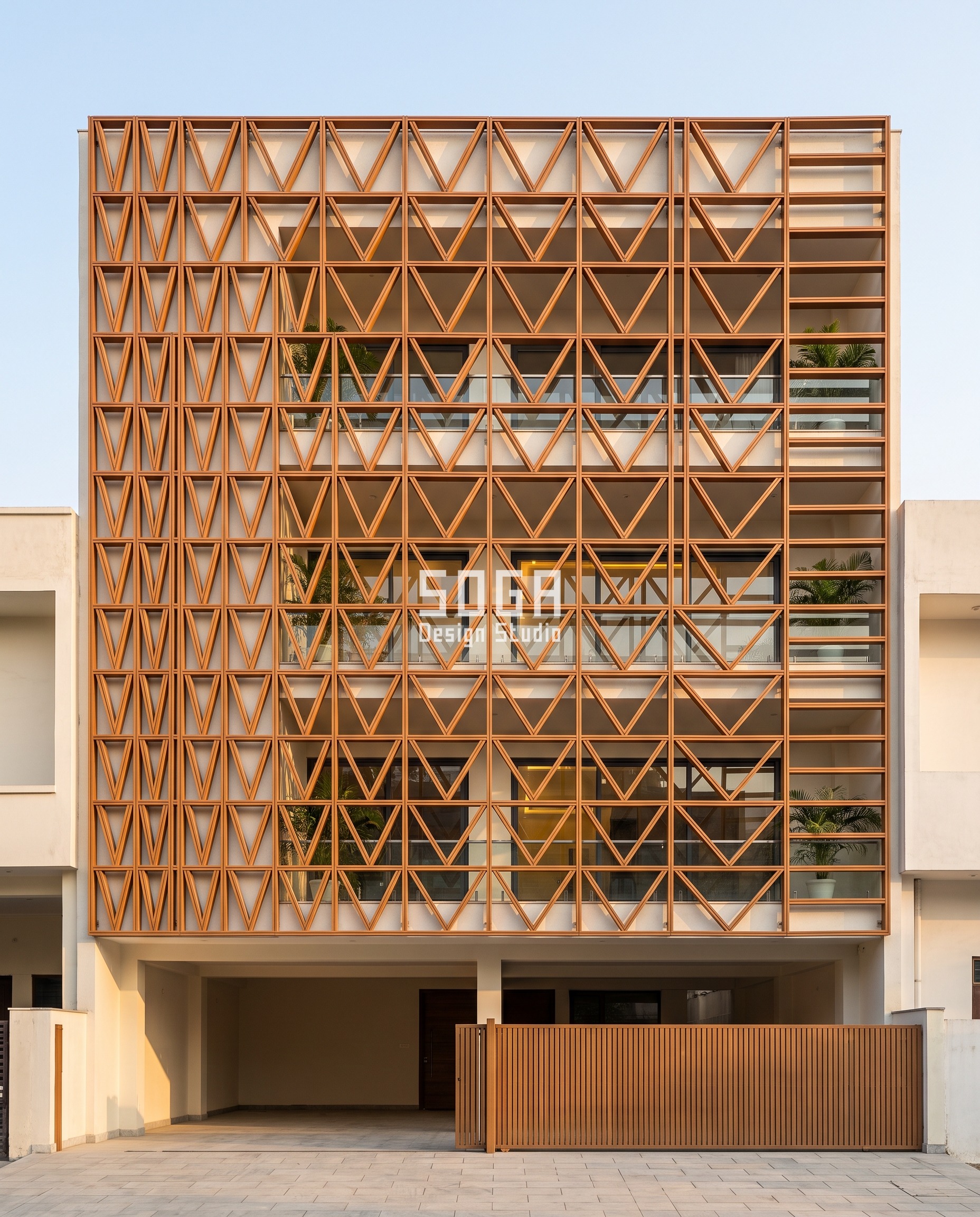 Attractor Point Facade Design: How Parametric Skins Work 7 Timber-toned chevron screen in Amritsar where the V included angle opens from 30 degrees at one end to 160 degrees at the other
