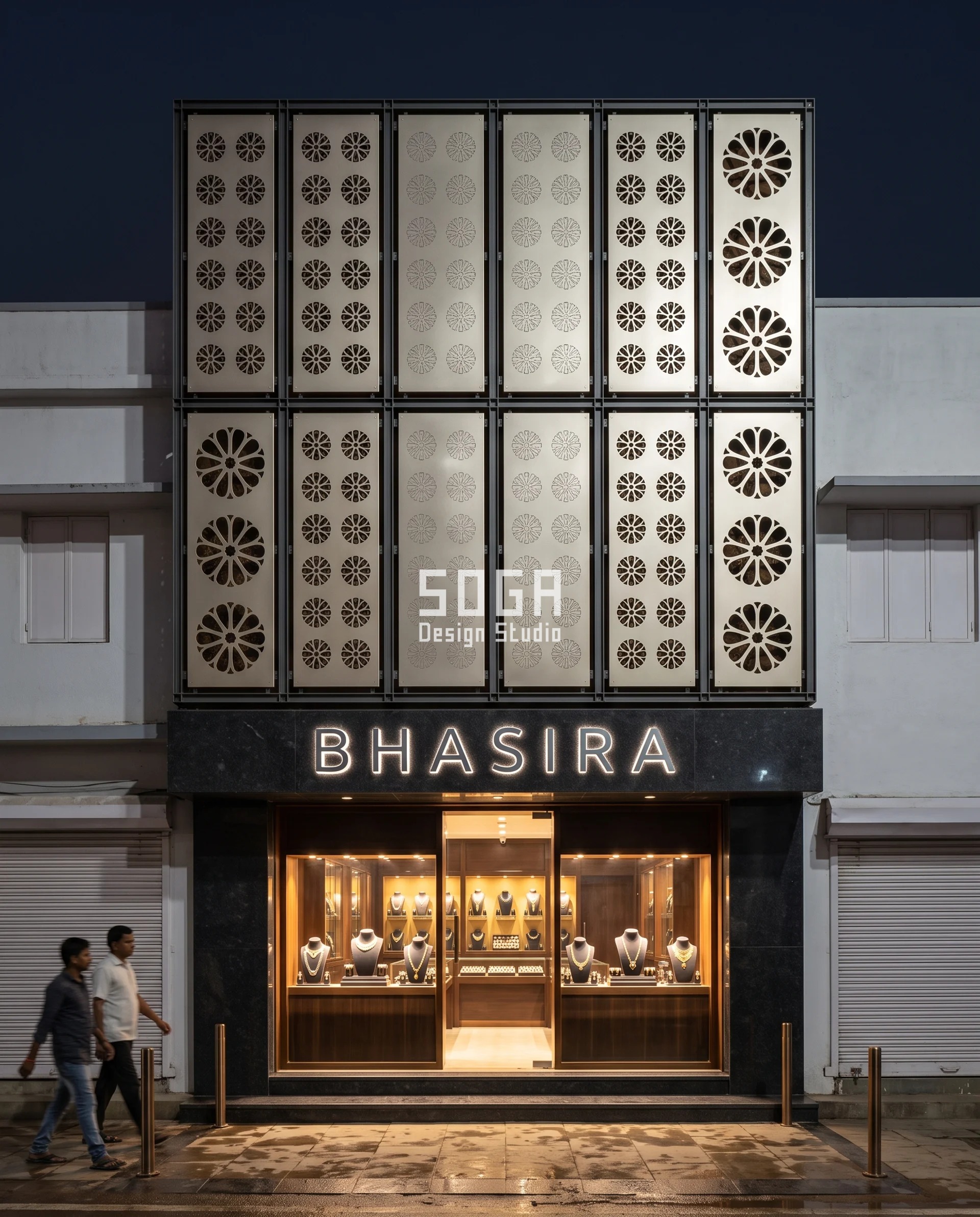 Graduated Perforation Jewellery Showroom Facade India 3 Twelve deep two-plate lattice cassettes on a narrow Cuttack silver showroom, shot square-on at night, the rosette slots cut wide and see-through at the entrance bay and closed to a textured solid over the first-floor vitrines - graduated perforation used as daylight control rather than pattern