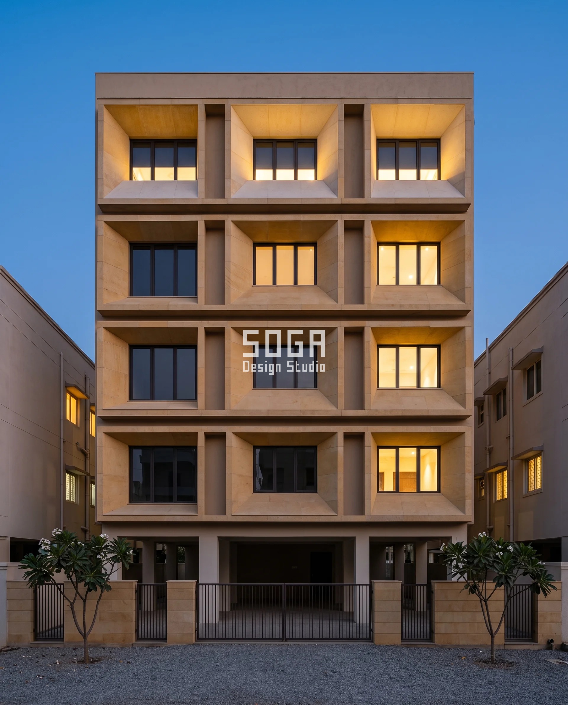 Stop Neighbours Looking Into House India: One-Sided Screen 4 A G+3 Karimnagar residence at blue hour, its cast-stone reveal tunnels lit from within, the dark glass sitting higher inside each opening floor by floor above a widening shelf of warm lit stone - the tunnel raked up to give the room sky and stop the facing bedroom looking into the house.