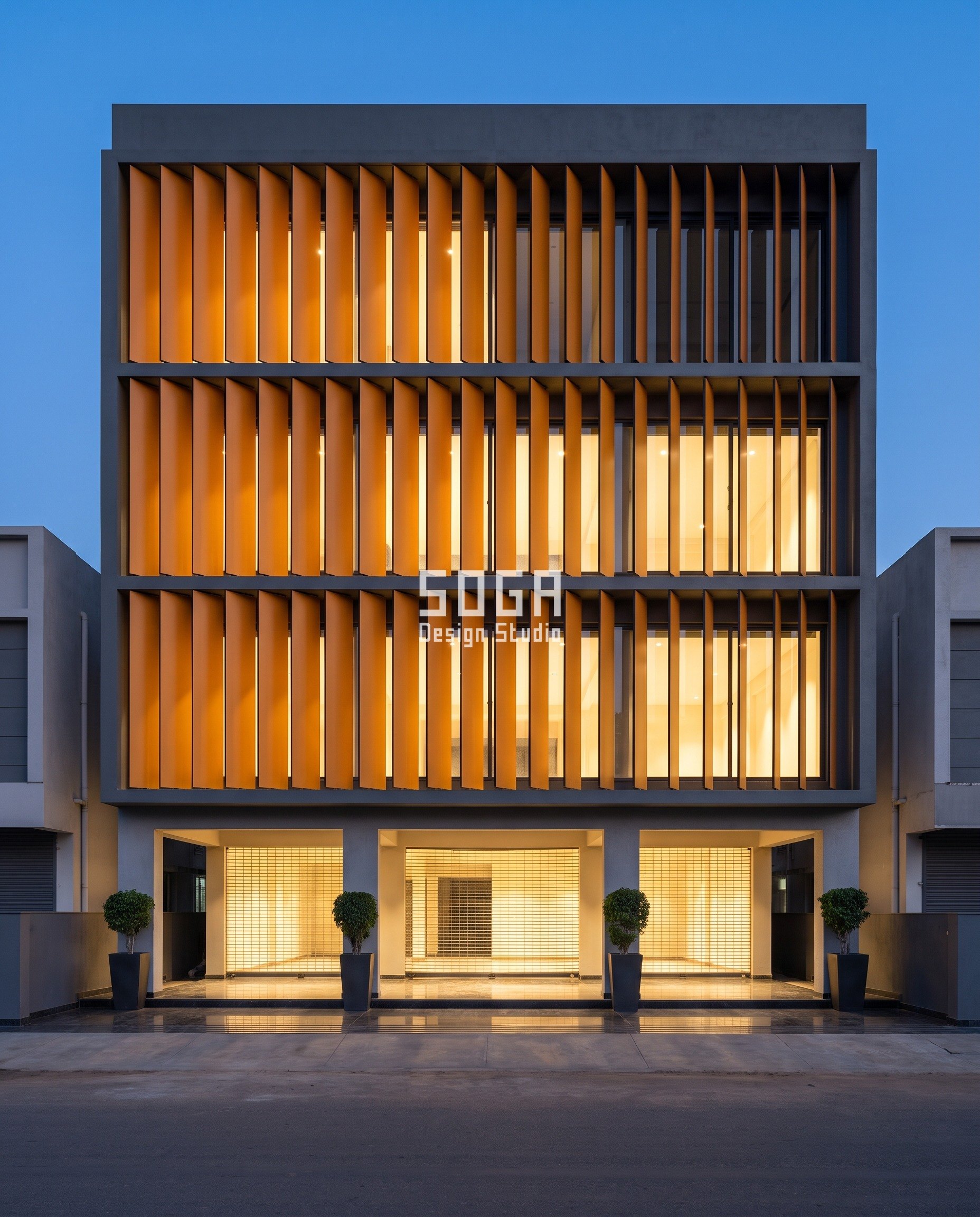 Elevation Panels Making Noise In Wind India: Detune It 4 Amber-caramel compact laminate blades turning from face-on to edge-on across a G+3 boutique showroom in Mathigiri, Hosur at dusk, the set angle detuning the vortex shedding that makes a facade whistle in wind.