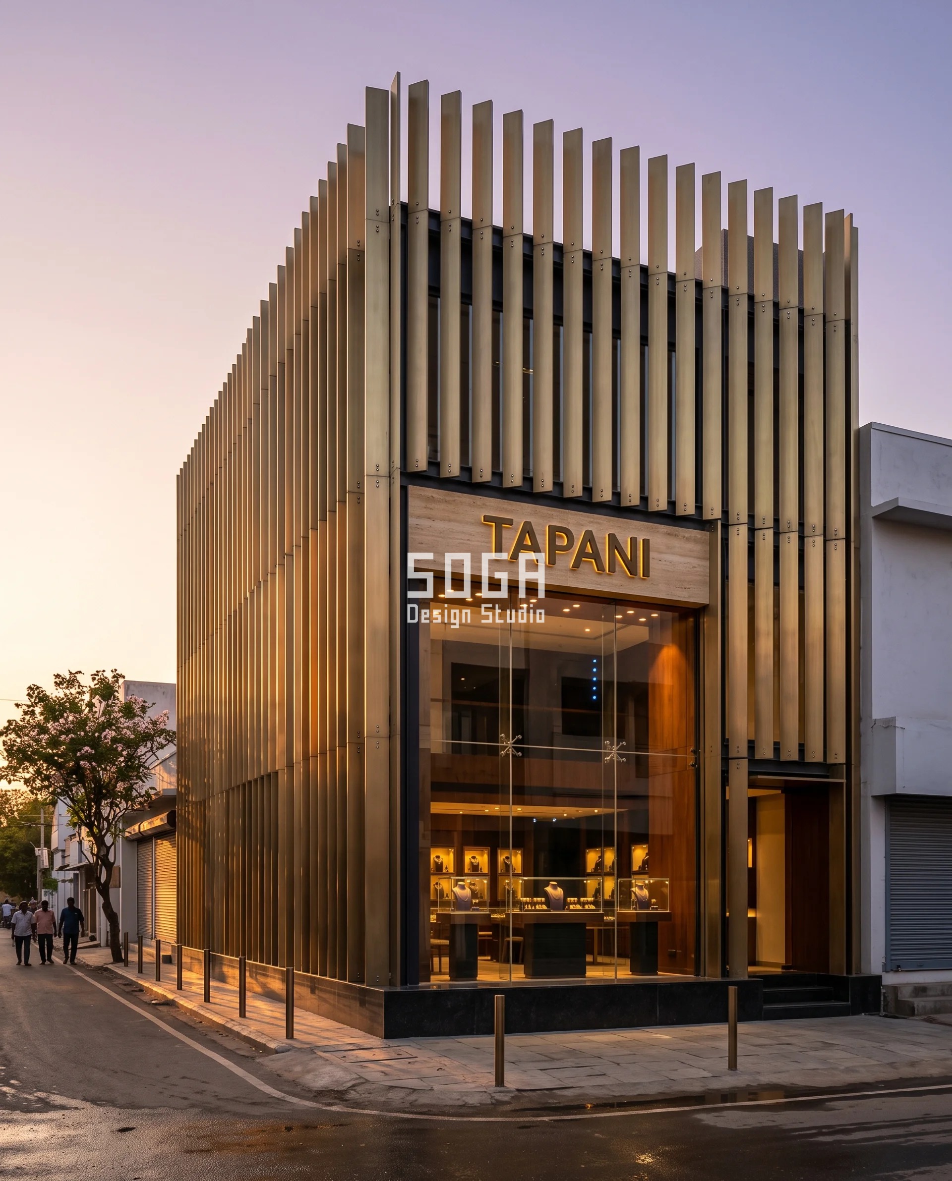 Graduated Perforation Jewellery Showroom Facade India 4 Brass-toned stainless fin pairs bolted to painted steel transoms on a Madurai jeweller at last light, the fins held at constant 250 mm centres while their projection deepens across the display window until the array shuts solid - a graduated screen shading the vitrine glass