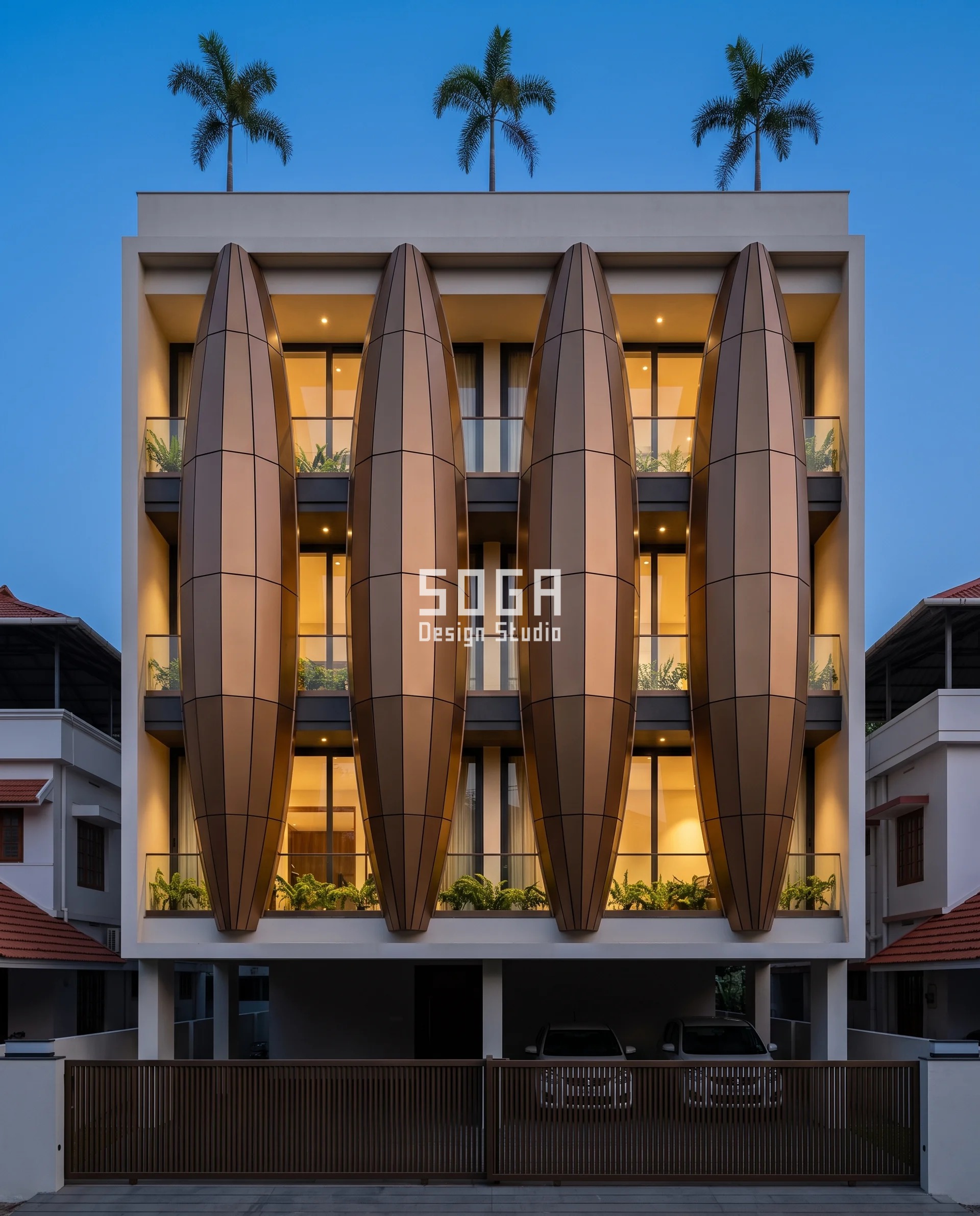 Reduce Road Noise House Facade India: Depth, Not Gaps 3 Blue-hour view of a Thrissur residence where four caramel-bronze faceted lobes reach up to 1850 mm out over the street and the full-height glazing glows warm in the deep shadowed gaps between them, the projection itself doing the work to reduce road noise on a house facade in India.