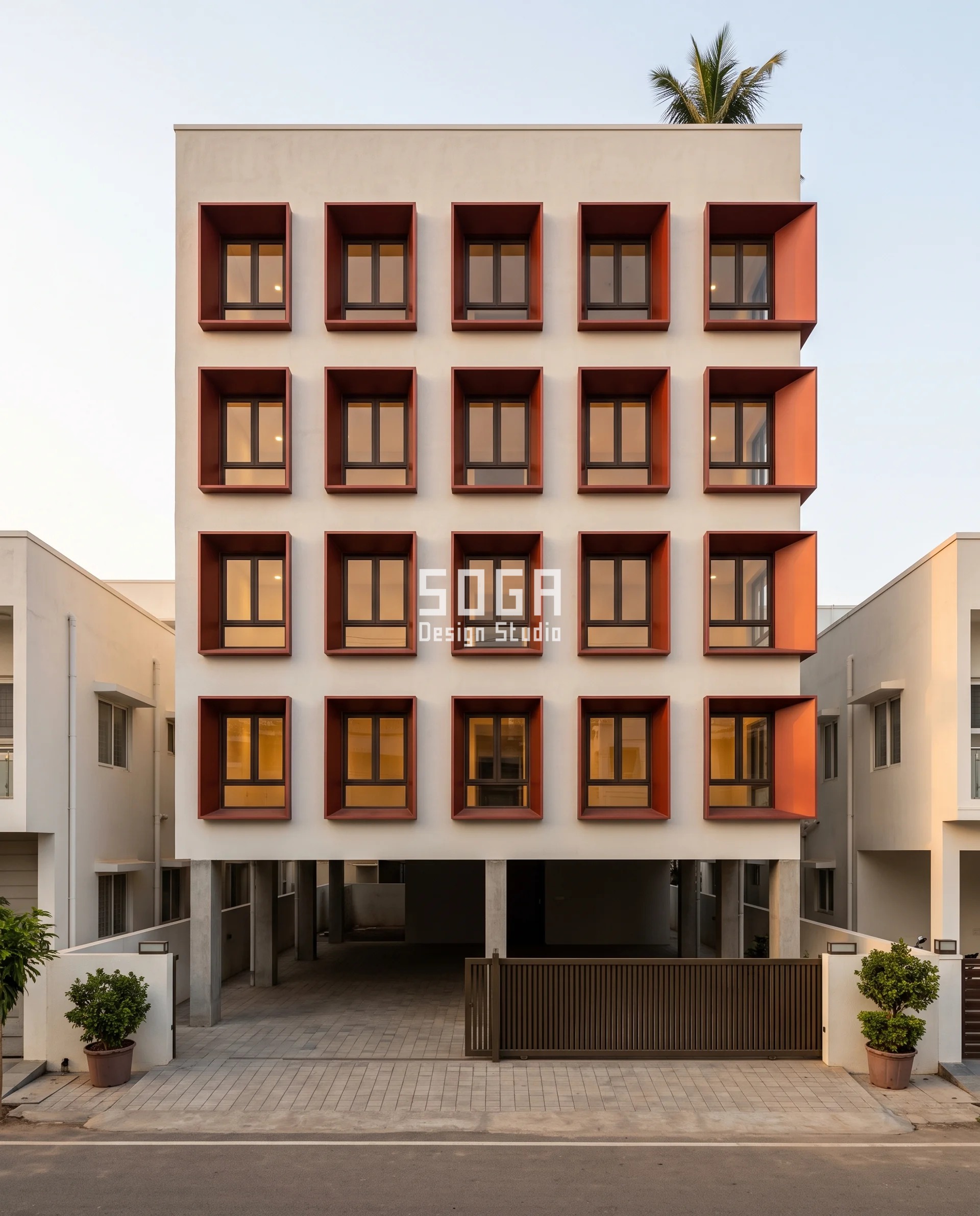 Facade Panel Wind Load India: Why Smaller Is Not Safer 5 Deep sienna-red anodised aluminium window reveals on a G+4 Kakinada house, each 450 mm recess splaying wider toward the exposed corner where facade panel wind load in India peaks.
