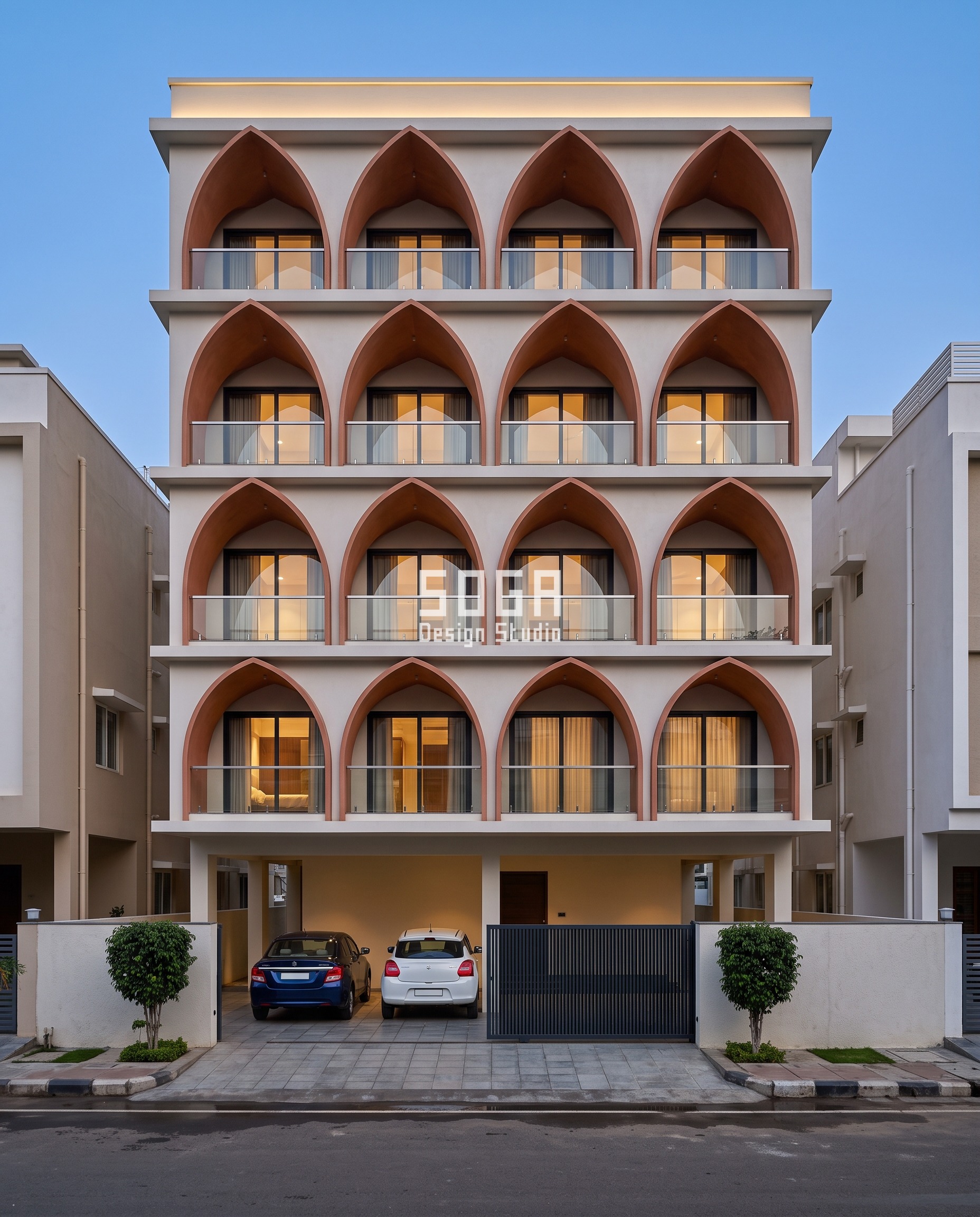 Zaha Hadid Style Facade Design India Without a Mould 4 Pointed clay-toned ferrocement vaults stacked floor on floor at dusk on a G+4 Salem house, cove light washing the curved soffits - flowing facade design India.