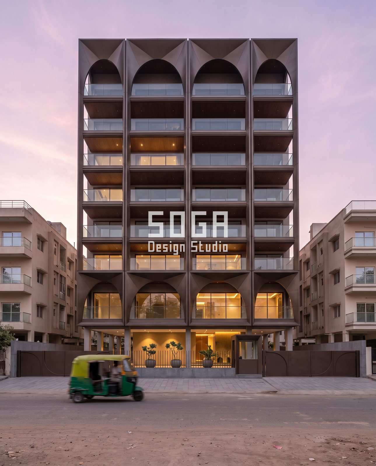 Slats, Folds, Loops, Arches and Ribbons: 5 Copper-Tone Balcony Facade Ideas for India 4 Arcade grid facade with bronze-tone fins and pointed arches on an eight-level building in India