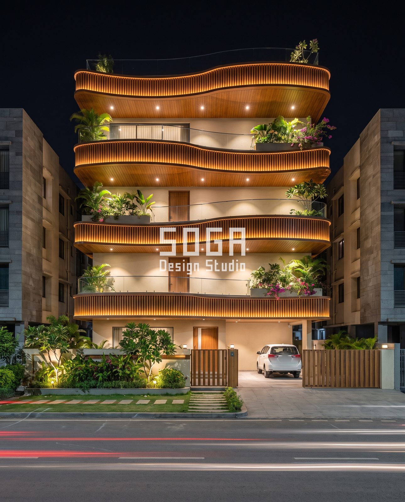 Slats, Folds, Loops, Arches and Ribbons: 5 Copper-Tone Balcony Facade Ideas for India 5 Wavy timber-tone slat ribbon balcony bands lit at night on a residential building in India