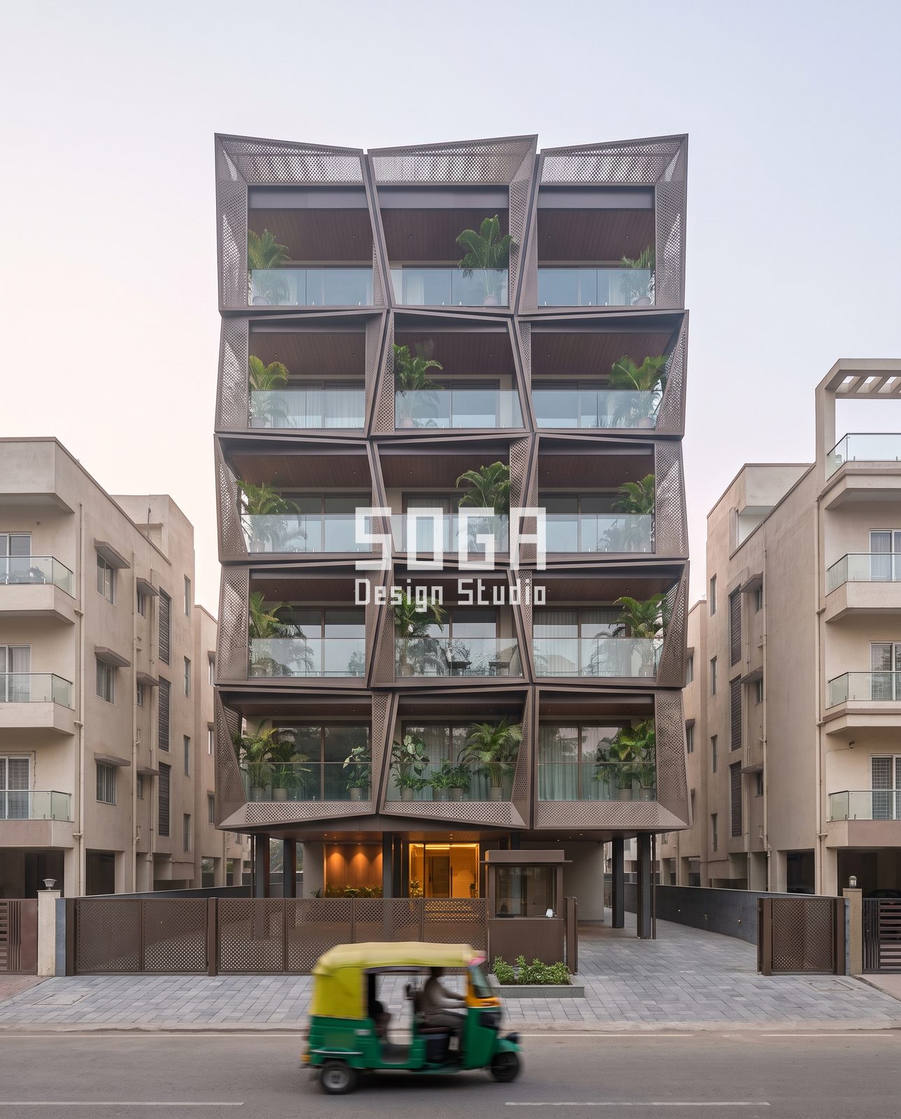 Arched, Draped, Curved and Tilted: 5 Balcony Facade Ideas for Indian Homes 5 Tilted perforated cell balcony facade India, G+5 grid of bronze-tone boxes with palms behind glass rails