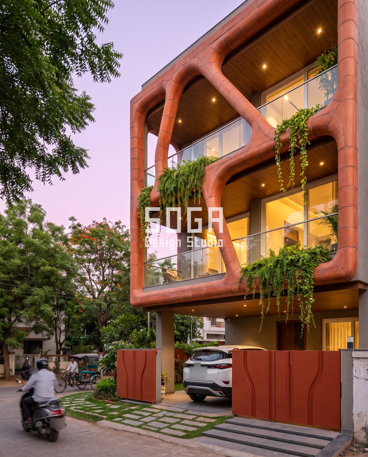 Angular, Triangulated, Finned, Draped and Looped: 5 Balcony Facade Ideas for India 5 Terracotta-tone looped tube frame around balconies at dusk on a corner house in India