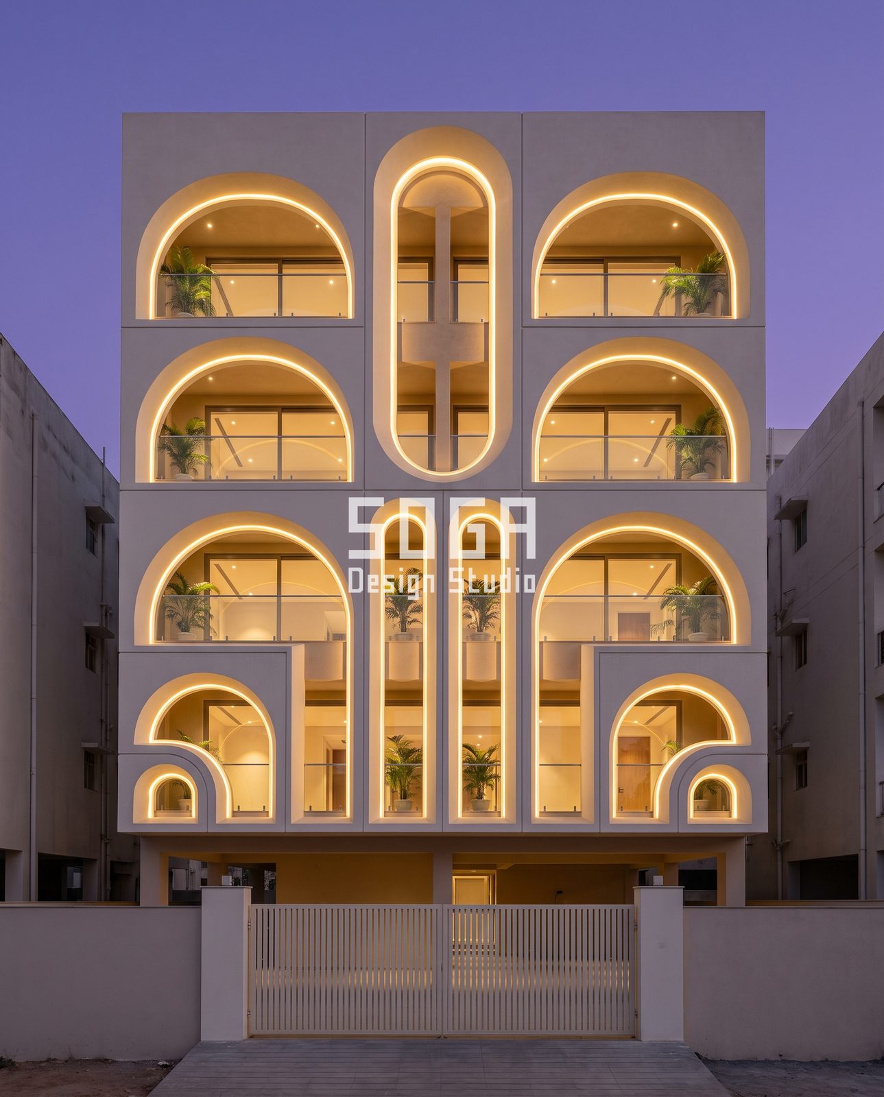 Curtain, Lit Bay, Diamond, Fin and Arch: 5 Elevation Ideas for Indian Homes 5 Blue-hour India residence with a three-column grid of half-round and capsule arches outlined by warm LED cove lines