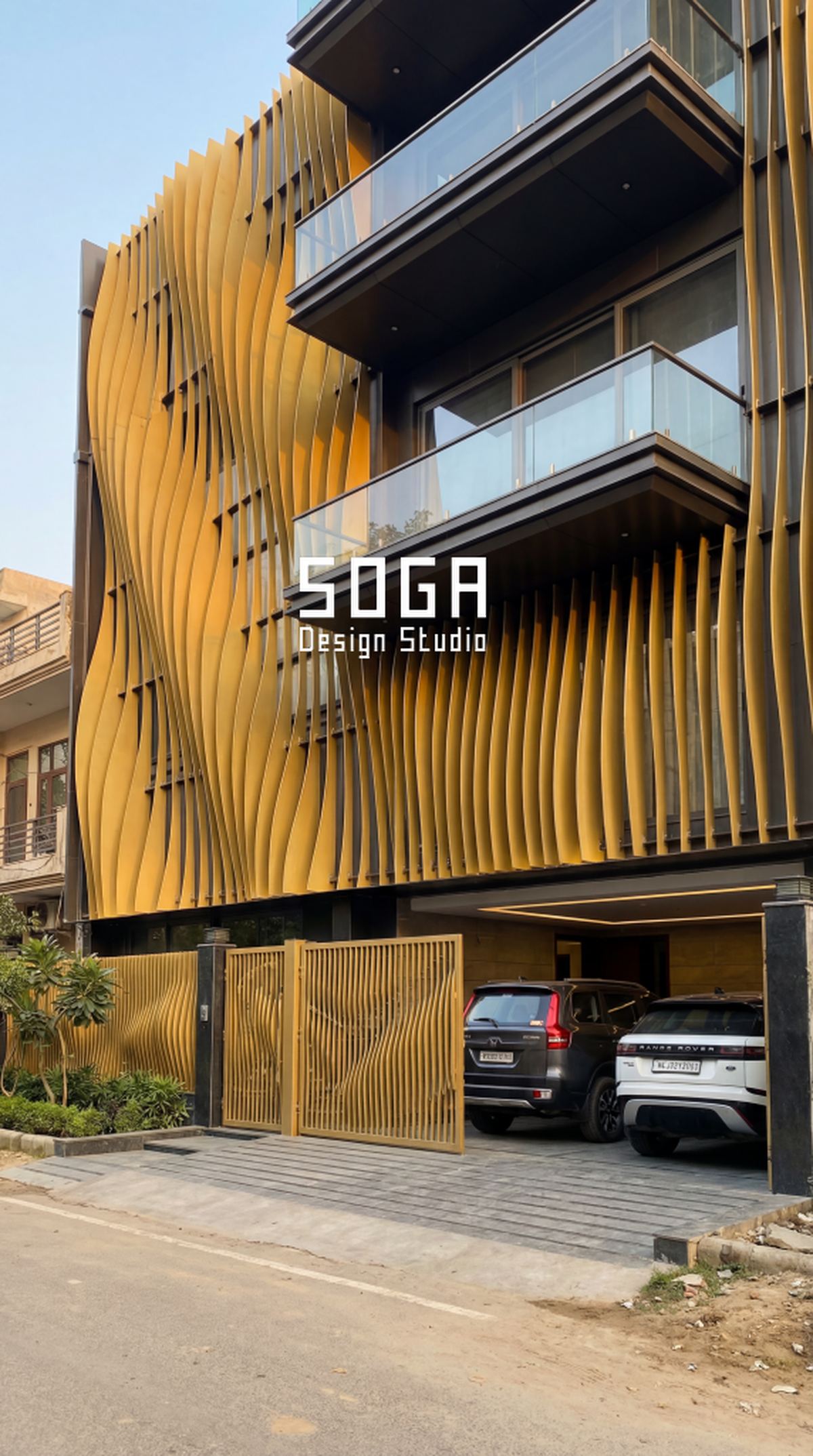 Parametric Facade Maintenance In India: The 20-Year Reality 1 Gold-toned angled metal fins on an Indian facade, a finish whose twenty-year appearance depends on the coating rather than the geometry