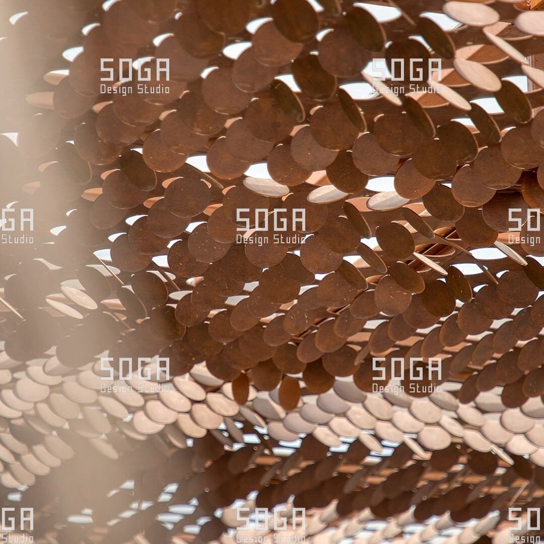 MetaCoin Facade System: How Rectangular Panels With Circular Coin Mechanisms Actually Work 4 Close-up of coin facade discs set at varying angles, catching light and casting shadow across the panel field
