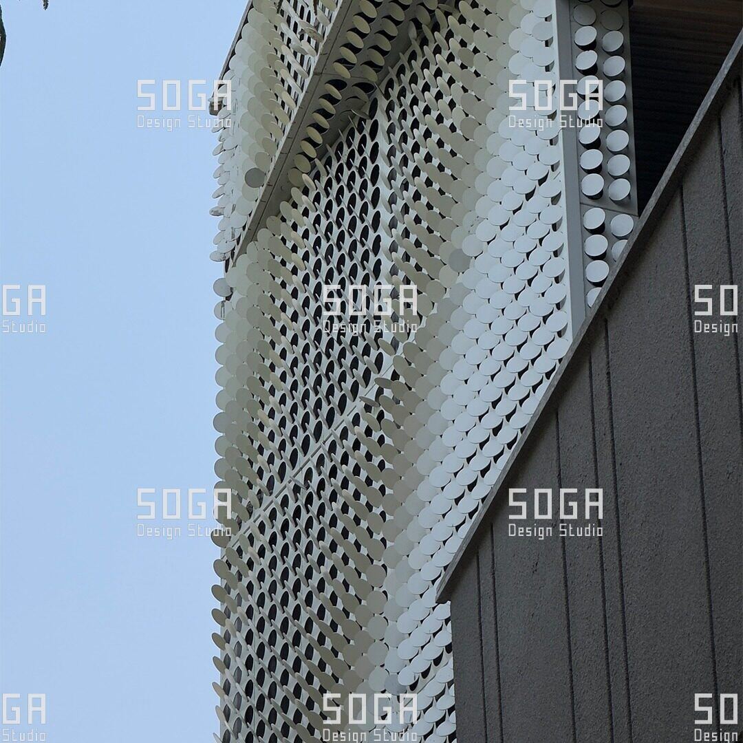 Parametric Coin Facade, Gurgaon: The Design Story Behind 216 Panels and a Field of Angled Coins 5 Coin facade panels at a building entrance, showing the repeating panel module and its coin field