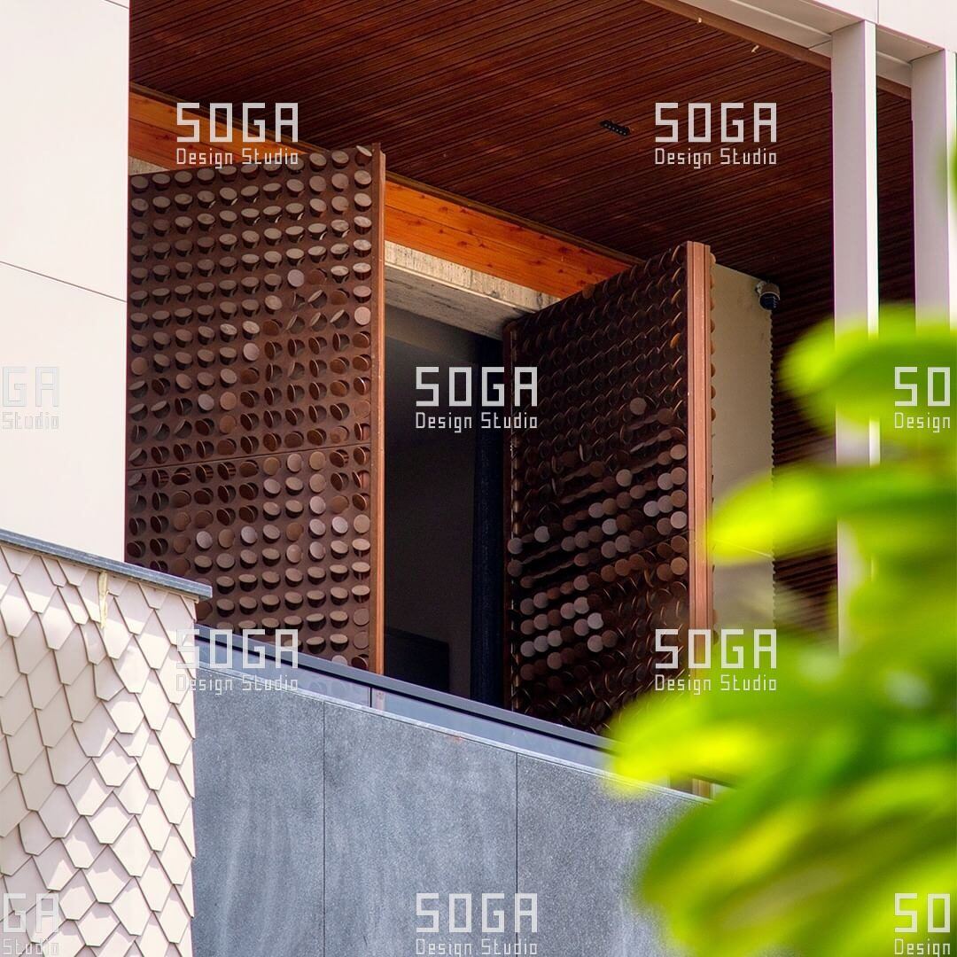 Parametric Coin Facade, Gurgaon: The Design Story Behind 216 Panels and a Field of Angled Coins 6 Coin facade screen on a building elevation with daylight raking across the panel field
