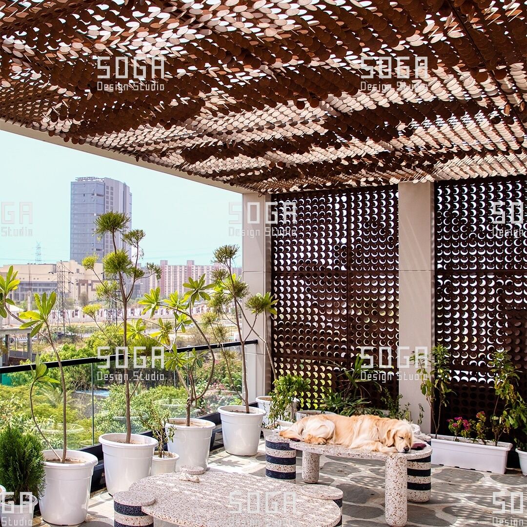 Coin Facade Design: The Parameters That Decide How a Coin Facade Looks 7 Coin facade used overhead and vertically around a terrace, with the city beyond